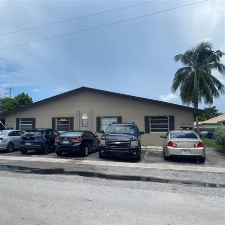 Buy this 12 bed house on 5401 Northwest 22nd Street in Lauderhill, FL 33313