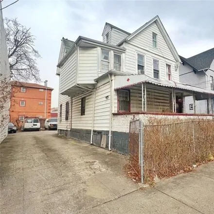 Buy this 8 bed house on 138-07 90th Avenue in New York, NY 11435