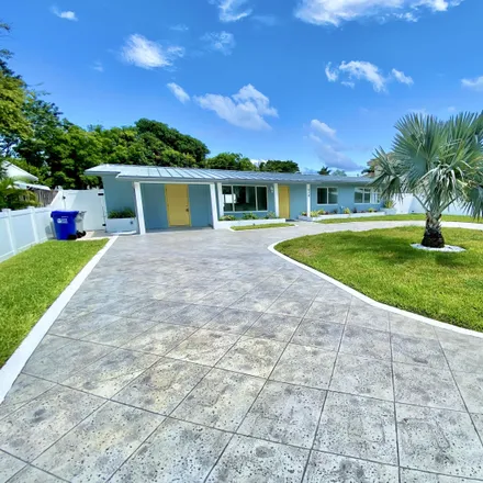 Rent this 3 bed house on 918 Northeast 24th Avenue in Harbor Village, Pompano Beach