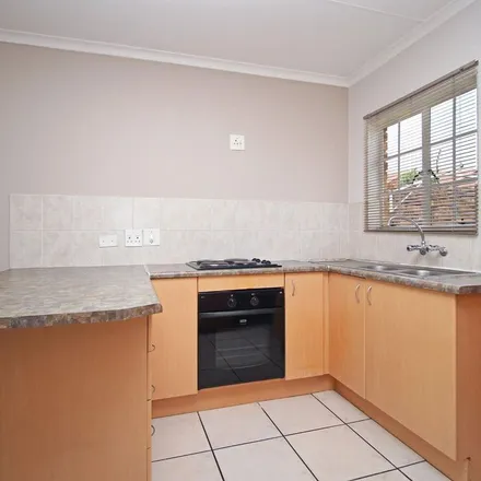 Rent this 2 bed townhouse on Dubloon Avenue in Wilgeheuwel, Roodepoort