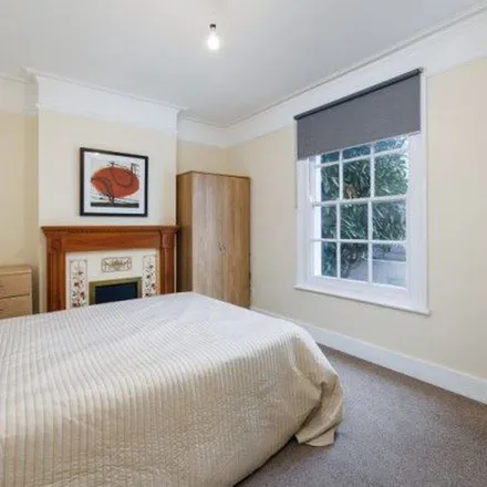 Rent this 3 bed townhouse on Hartfield Crescent in London, SW19 3SB