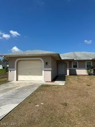 Rent this 3 bed house on 766 Jenna Avenue South in Lehigh Acres, FL 33973