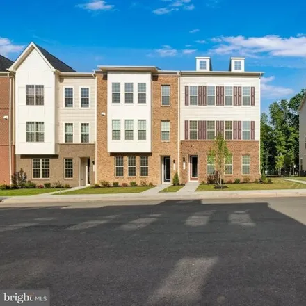 Rent this 3 bed townhouse on Soaring Raven Alley Northeast in Leesburg, VA 20176
