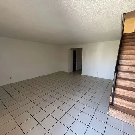 Rent this 3 bed apartment on 1024 West 84th Place in Los Angeles, CA 90044