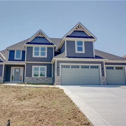 Buy this 4 bed house on 1001 Northeast Whispering Winds Circle in Lee's Summit, MO 64064