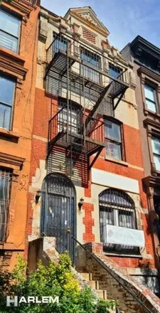 Buy this 6 bed townhouse on 111 West 132nd Street in New York, NY 10027