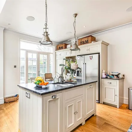 Rent this 4 bed townhouse on 17 Sutherland Gardens in London, SW14 8DB