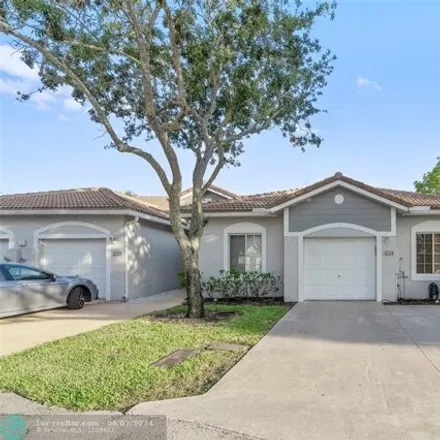 Buy this 3 bed house on 4758 SW 12th Pl Unit 4758 in Deerfield Beach, Florida