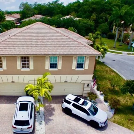 Rent this 3 bed house on 3675 Asperwood Circle in Coconut Creek, FL 33073