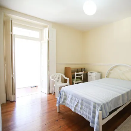 Rent this 4 bed room on Rua António Pereira Carrilho 30 in 1000-047 Lisbon, Portugal