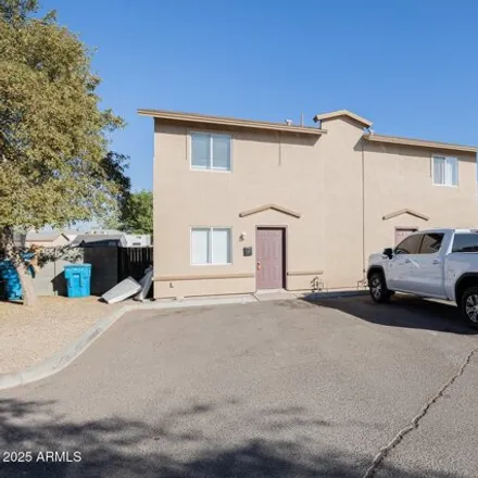 Rent this 3 bed townhouse on 3506 E Melvin St Unit A in Phoenix, Arizona