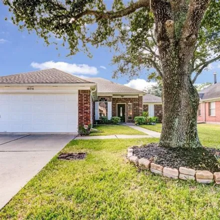 Rent this 3 bed house on 19735 Vernier Woods Lane in Harris County, TX 77379