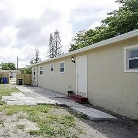 Buy this 4 bed house on 2062 Northwest 30th Way in Flamingo Village, Fort Lauderdale
