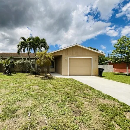 Rent this 3 bed house on 749 NW Bayard Ave in Port Saint Lucie, Florida