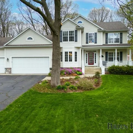 Buy this 5 bed house on 5125 Brownstone Drive Northeast in Cannon Township, MI 49341