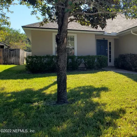 Rent this 3 bed house on 712 South Lilac Loop in Fruit Cove, FL 32259