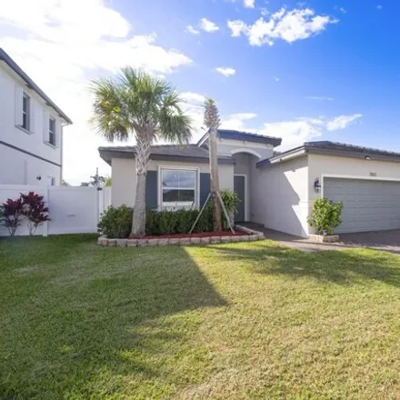 Buy this 3 bed house on 7917 Southwest Greenbank Circle in Port Saint Lucie, FL 34986