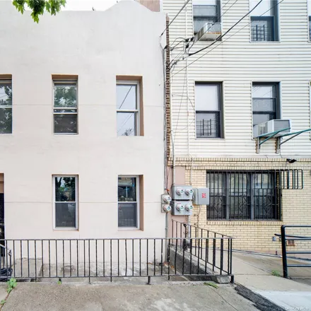 Buy this 6 bed townhouse on East New York Avenue in New York, NY 11207