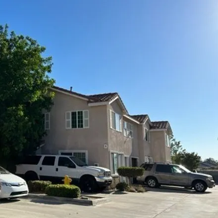 Rent this 3 bed townhouse on 992 South Riverside Avenue in Rialto, CA 92376