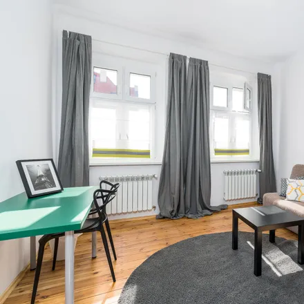 Rent this 4 bed room on Henryka Siemiradzkiego 10a in 60-763 Poznan, Poland