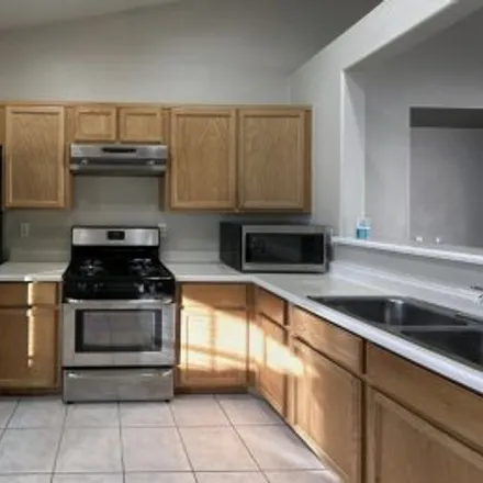 Rent this 3 bed apartment on 5122 Pebble Rim Street in Cobblestone Cove, North Las Vegas