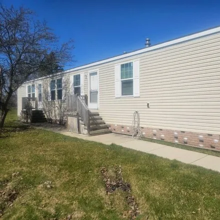 Buy this studio apartment on 46235 Worlington Drive in Macomb Township, MI 48044