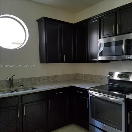 Rent this 3 bed condo on Atlas Trail in Doral, FL 33178
