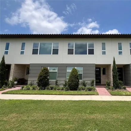 Rent this 3 bed townhouse on Sunnifa Alley in Orange County, FL 32832
