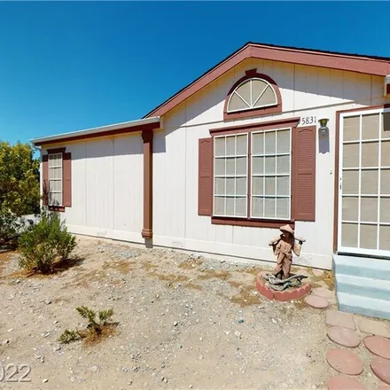 Buy this 4 bed house on 5831 North Nopah Vista Avenue in Pahrump, NV 89060