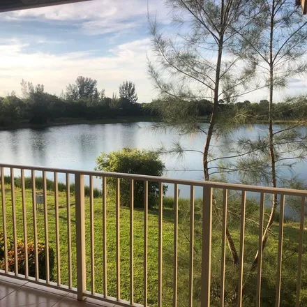Rent this 3 bed apartment on Lake Susan Lane in Golden Lakes, Palm Beach County