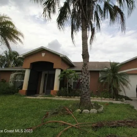 Rent this 3 bed house on 571 Olsmar St SW in Palm Bay, Florida