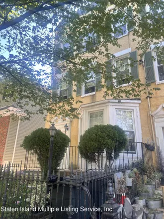 Buy this 4 bed duplex on 407 Westervelt Avenue in New York, NY 10301