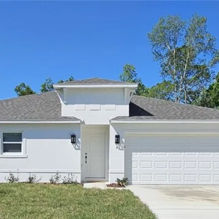 Rent this 4 bed house on 32 Pine Bluff Lane in Palm Coast, FL 32164