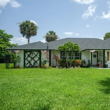 Rent this 3 bed house on 7168 High Sierra Circle in Golden Lakes, Palm Beach County