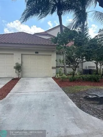 Rent this 3 bed house on Daddy Design in 980 Northwest 93rd Avenue, Plantation