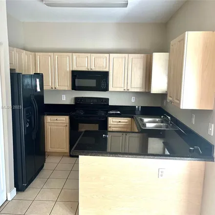 Rent this 3 bed apartment on 373 Northeast 25th Place in Homestead, FL 33033