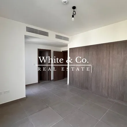 Rent this 3 bed townhouse on Yasmeen 2 street in Emirates Hills, Dubai