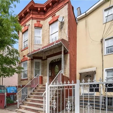 Buy this 6 bed townhouse on 555 Ashford Street in New York, NY 11207