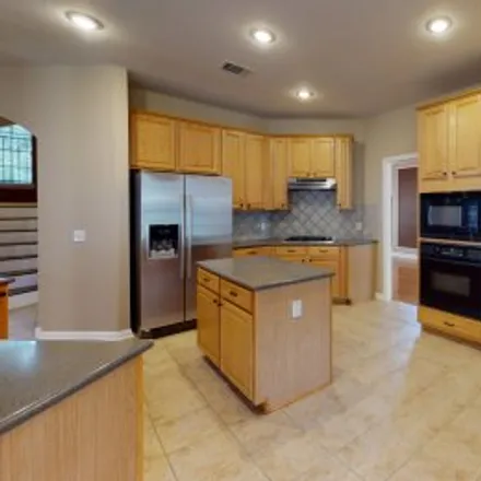 Rent this 5 bed apartment on 15123 Terra Verde Drive in Champions, Austin