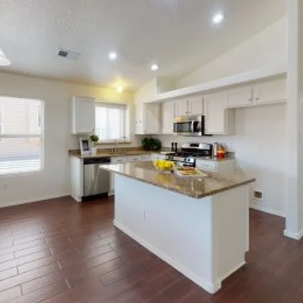 Buy this 4 bed apartment on 8604 Silk Tassel Road Northwest in Montecito Estates, Albuquerque