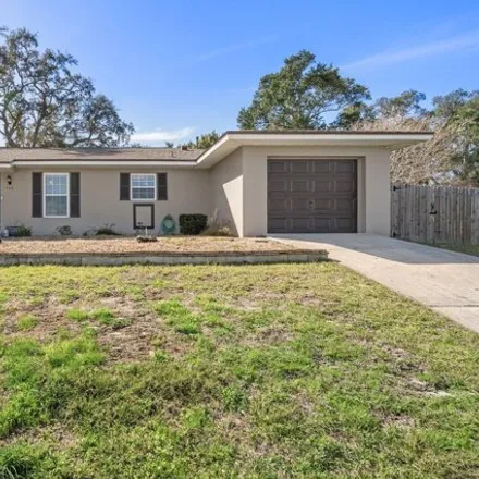 Buy this 3 bed house on 7318 Holiday Dr in Spring Hill, Florida
