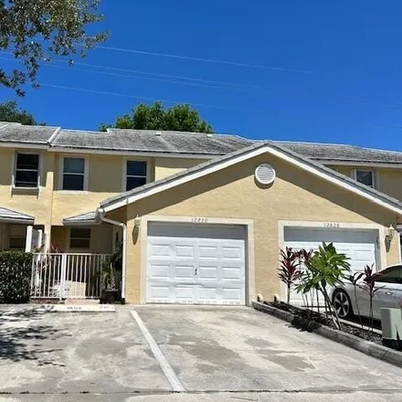 Rent this 3 bed house on 12830 Woodmill Dr in Palm Beach Gardens, Florida