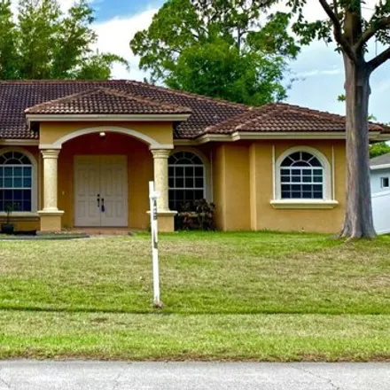 Buy this 4 bed house on 2217 SW Elmwood Ave in Port Saint Lucie, Florida