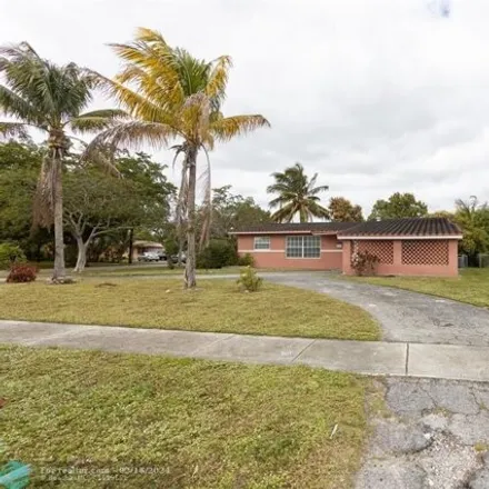 Rent this 3 bed house on 310 Northwest 48th Avenue in Breezeswept Park Estates, Plantation