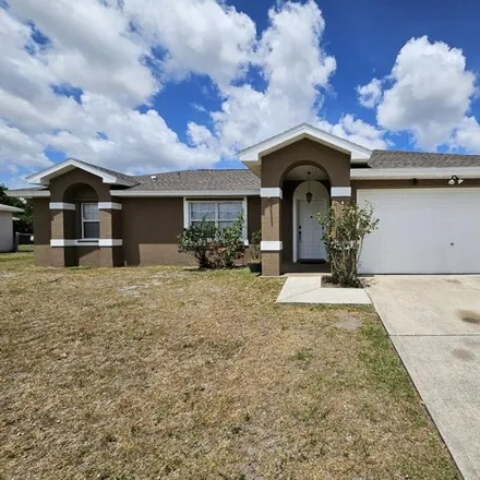Rent this 3 bed house on 1537 Hero Street Southeast in Palm Bay, FL 32909