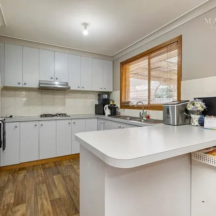 Rent this 3 bed apartment on Dalman Parkway in Glenfield Park NSW 2650, Australia