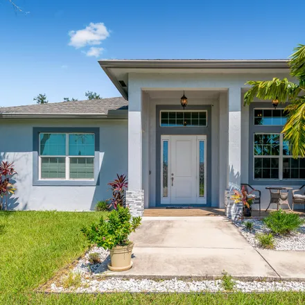 Buy this 4 bed house on 167 Southwest Donna Terrace in Port Saint Lucie, FL 34984