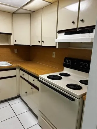 Rent this 2 bed condo on 1555 W 44th Pl Apt 316 in Hialeah, Florida