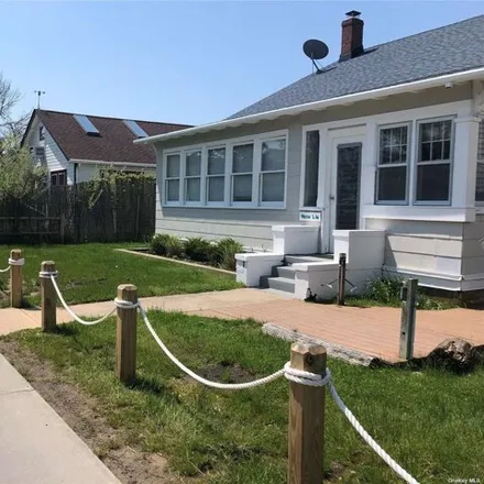 Rent this 5 bed house on 180 Cottage Walk in Village of Ocean Beach, Islip