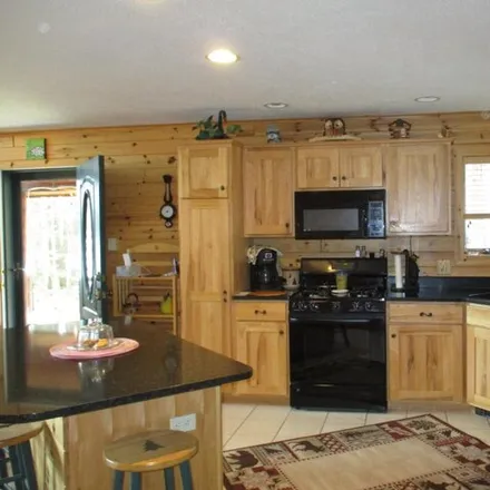 Image 8 - 5574 Vacation Land Drive, Greenwood Township, MI 49756, USA - House for sale